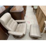 A STRESSLESS SWIVEL RECLINING CHAIR AND MATCHING STOOL