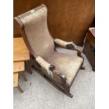 A CHILDS SIZE VICTORIAN ROCKING CHAIR