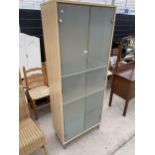 A MODERN SMOKED GLASS TWO DOOR STORAGE CABINET, 29" WIDE