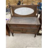 AN EARLY 20TH CENTURY OAK WASHSTAND WITH MARBLE BACK ON BARLEYTWIST LEGS (LACKING MARBLE TOP)