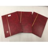 THREE RED STOCK BOOKS CONTAINING PREDOMINANTLY GB STAMPS