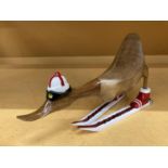 A MODEL OF A WOODEN DUCK ON SKIS LENGTH APPROX 43CM, HEIGHT 24CM
