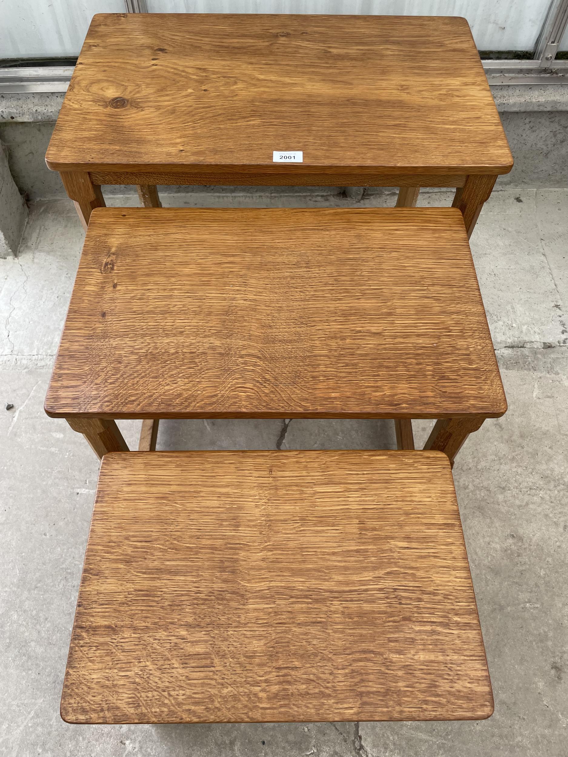 A MID 20TH CENTURY ROBERT 'MOUSEMAN' THOMPSON NEST OF THREE OAK TABLES ON OCTAGONAL LEGS, WITH ADZED - Image 3 of 7
