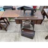 A NEW HOME 'D' TREADLE SEWING MACHINE AND BRADBURY & CO TABLE TOP SEWING MACHINE
