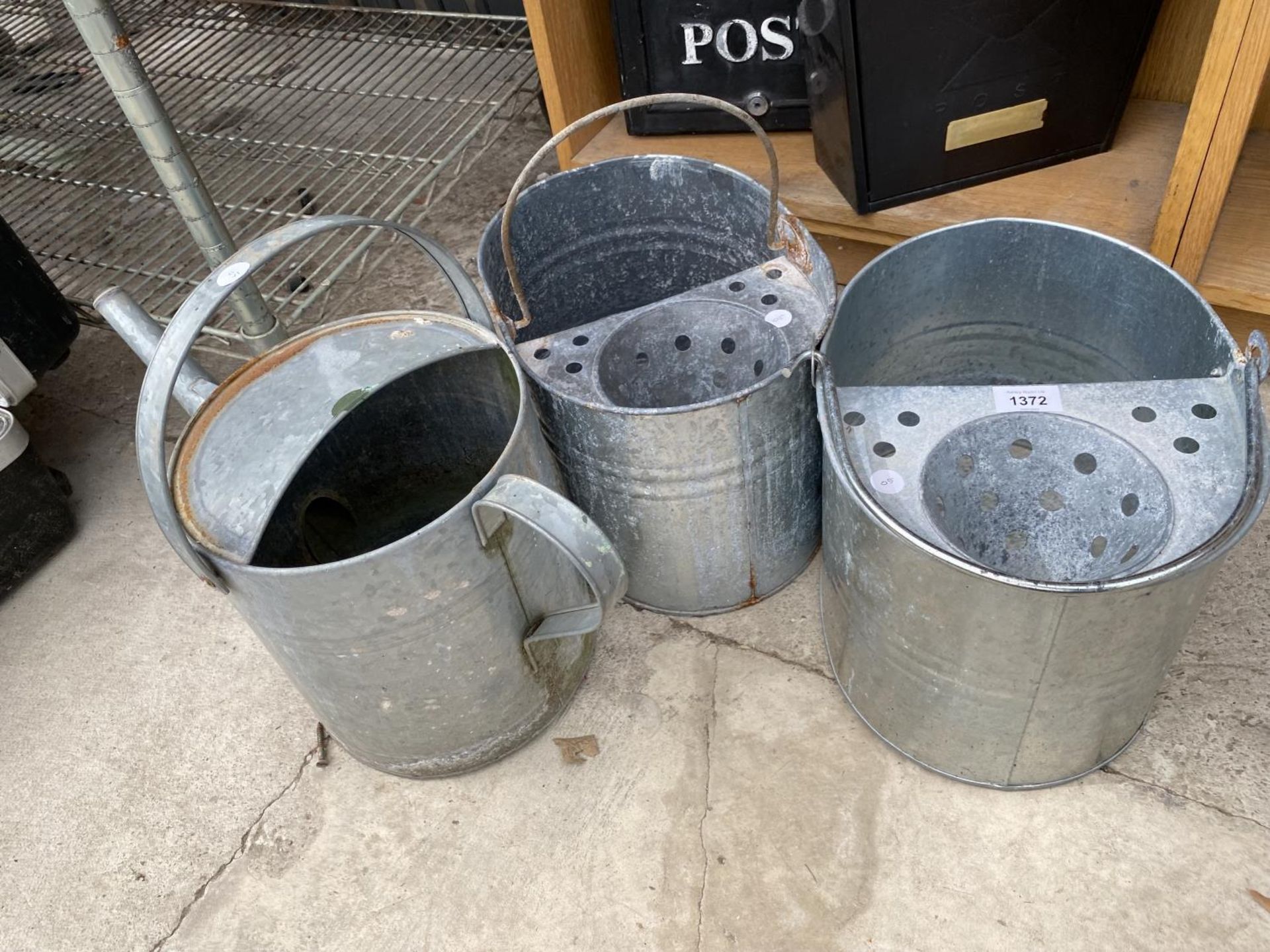 TWO GALVANISED MOP BUCKETS AND A GALVANISED WATERING CAN