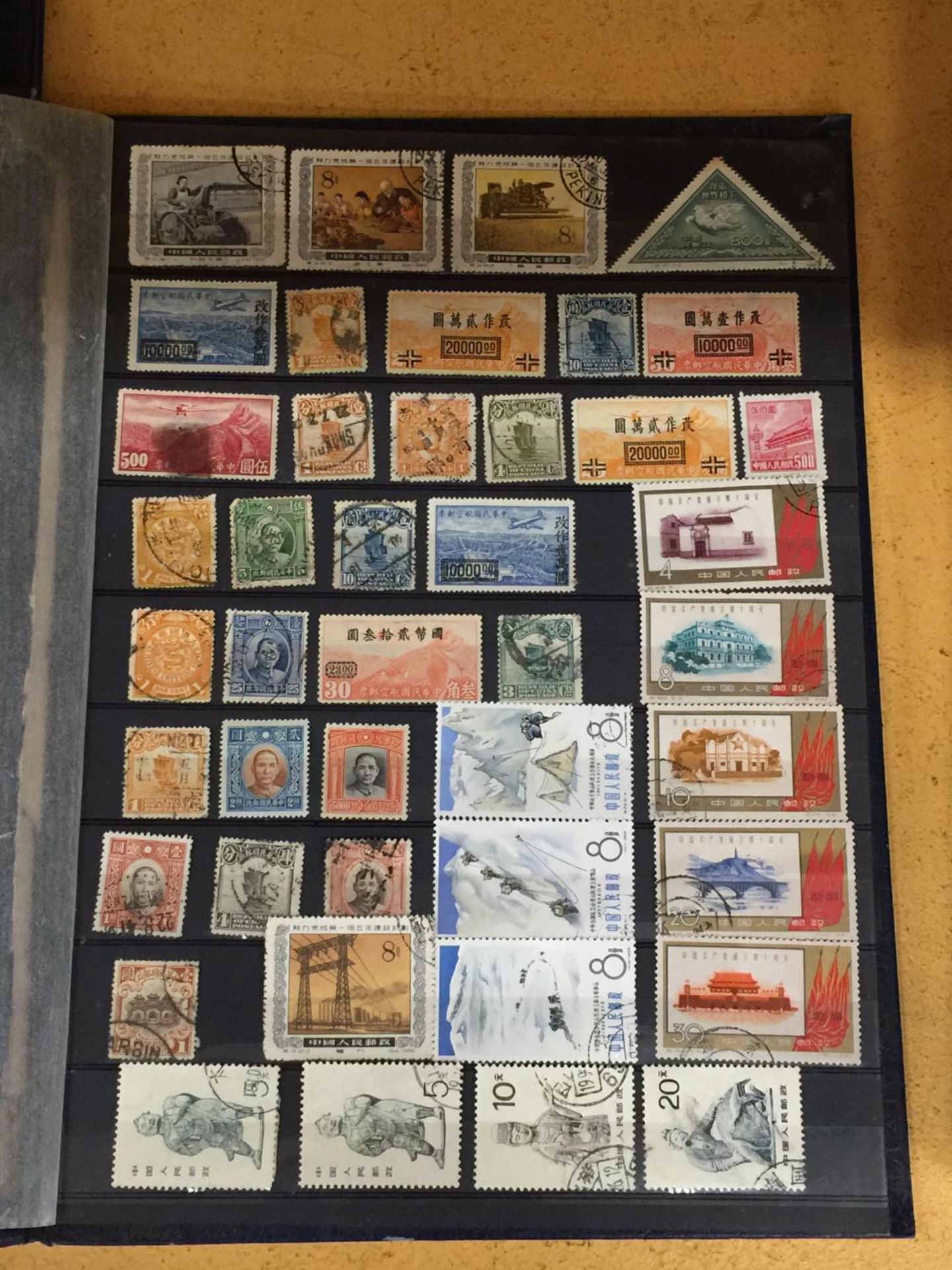 AN ALBUM CONTAINING RARE AND COLLECTABLE MOSTLY ASIAN STAMPS - Image 2 of 7