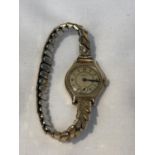 A 9CT GOLD CASED MECHANICAL LADY'S WRISTWATCH BY BUTT & CO LTD OF CHESTER, WORKING AT THE THE TIME
