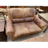 A MODERN BROWN LEATHER TWO SEATER SETTEE