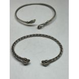 TWO MARKED SILVER BANGLES TO INCLUDE A SNAKE AND A RAMS HEAD DESIGN