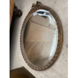 A W.M. MORRIS REPRO LTD GILT FRAMED OVAL WALL MIRROR