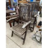 A PAIR OF FOLDING TEAK GARDEN CHAIRS