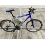 A GENTS APOLLO MOUNTAIN BIKE WITH FRONT SUSPENSION AND 21 SPEED GEAR SYSTEM