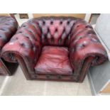 AN OXBLOOD CHESTERFIELD EASY CHAIR