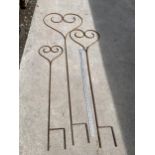 A GRADUATED SET OF THREE WROUGHT IRON HEART SHAPED PLANT SUPPORTS/GARDEN FEATURES