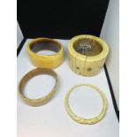 FOUR LARGE BONE BANGLES