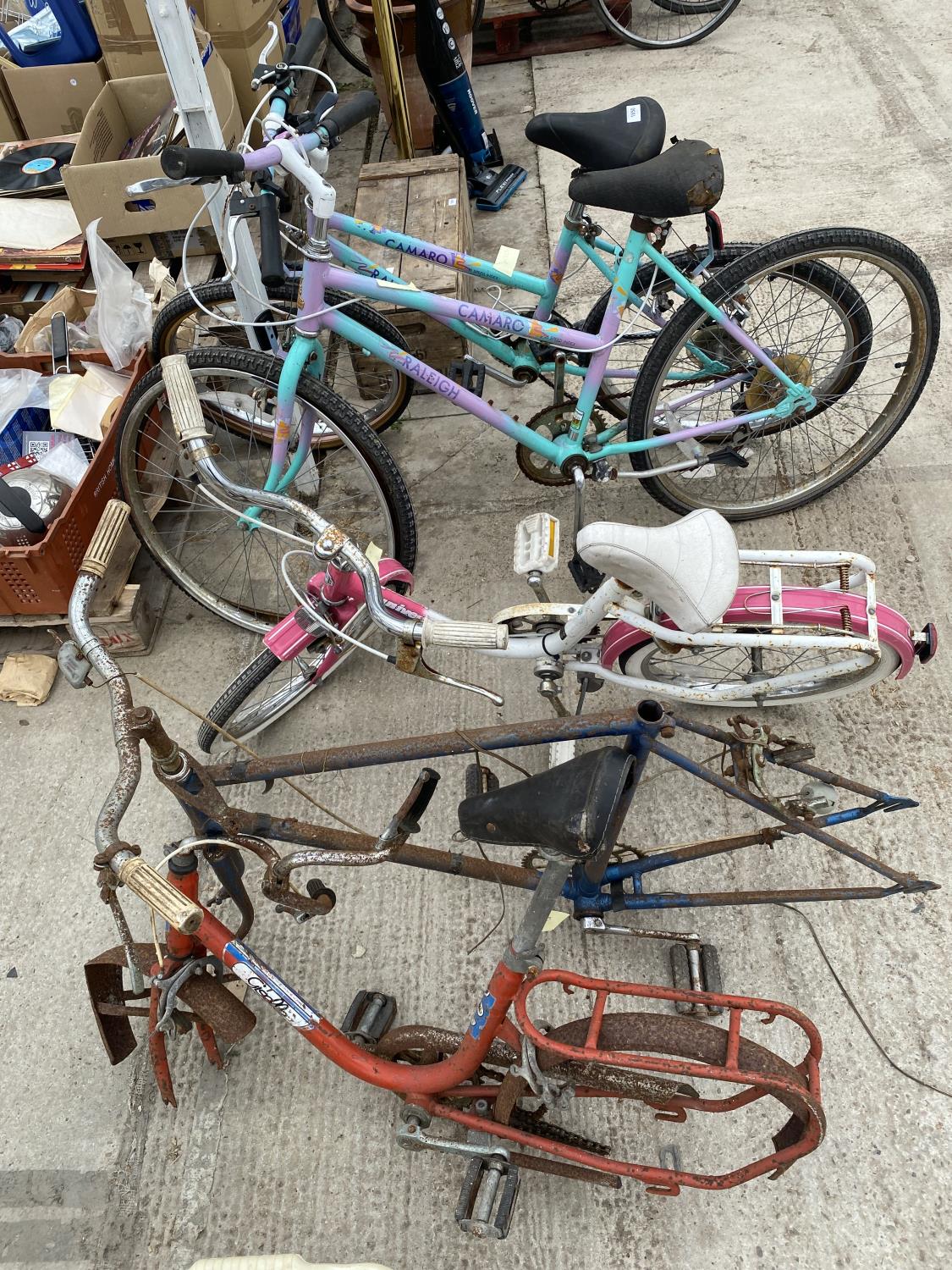 A COLLECTION OF CHILDRENS BIKES AND BIKE PARTS
