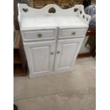 A PAINTED PINE TWO DOOR CABINET WITH GALLERY BACK, 32" WIDE