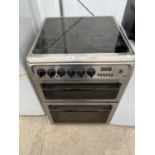 A SILVER HOTPOINT ELECTRIC OVEN AND HOB