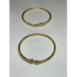 TWO SILVER GILT BANGLES