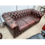 AN OXBLOOD CHESTERFIELD THREE SEATER SETTEE