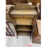 A SMALL MID 20TH CENTURY OAK BUREAU WITH OPEN SHELVES TO THE BASE, 22" WIDE