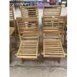 A SET OF FOUR BRAND NEW TEAK FOLDING GARDEN CHAIRS