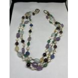 A SILVER AND AGATE THREE STRAND NECKLACE