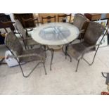 A GLASS TOPPED GARDEN TABLE WITH FOUR WICKER SEATED CHAIRS