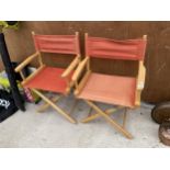 A PAIR OF WOODEN FOLDING DIRECTORS CHAIRS