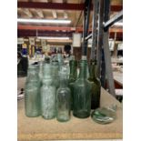 A QUANTITY OF VINTAGE BOTTLES, SOME WITH MARBLE STOPPERS IN