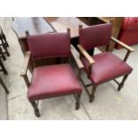 A PAIR OF JACOBEAN STYLE STUDDED ELBOW CHAIRS