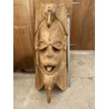 A LARGE HAND CARVED OAK TRIBAL WALL HANGING MASK (H:115CM)