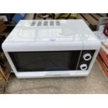 A WHITE HOTPOINT MICROWAVE OVEN