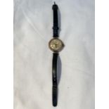 A 9CT GOLD CASED 1930s MARBLA MECHANICAL WRISTWATCH WITH LEATHER STRAP, WORKING AT THE TIME OF