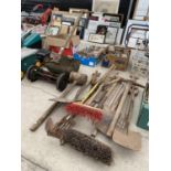 AN ASSORTMENT OF GARDEN TOOLS TO INCLUDE A RANSOMES VINTAGE PUSH MOWER, SPADES AND FORKS ETC