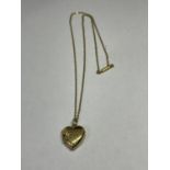 A 9 CARAT GOLD CHAIN AND HEART SHAPED LOCKET GROSS WEIGHT 4.0 GRAMS