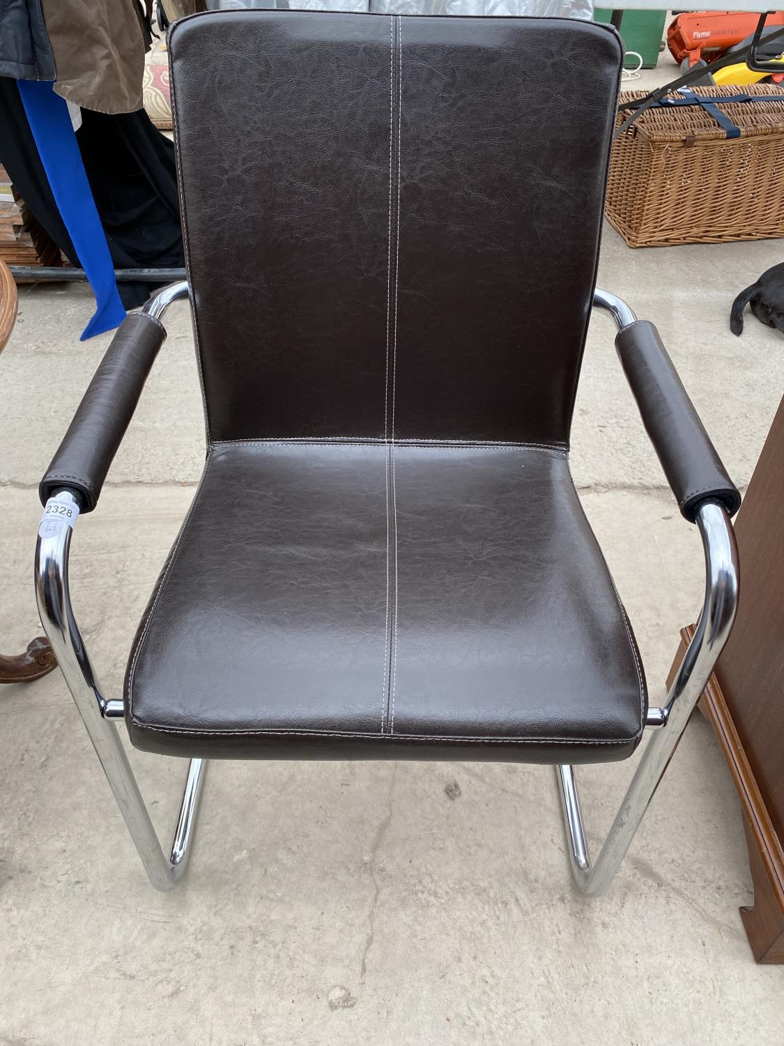 A FAUX LEATHER AND CHROME OFFICE CHAIR