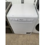 A WHITE HOTPOINT AQUARIUS DISH WASHER