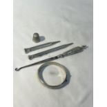 FIVE VARIOUS HALLMARKED SILVER ITEMS TO INCLUDE A SILVER HANDLED BUTTON HOOK, A BANGLE, THIMBLE