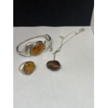 A SILVER AND AMBER BANGLE, RING AND PENDANT NECKLACE