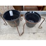 A PAIR OF METAL PLANT POT HOLDERS