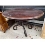AN OVAL LOO TYPE TABLE ON BENTWOOD FOUR SECTION BASE
