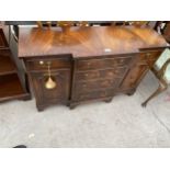 A MINIATURE MAHOGANY AND CROSSBANDED BREAKFRONT SIDEBOARD, 41" WIDE