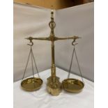 A SET OF BRASS BALANCE SCALES COMPLETE WITH WEIGHTS HEIGHT 56CM