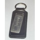 A LEATHER KEYRING WITH A HALLMARKED BIRMINGHAM SILVER INGOT