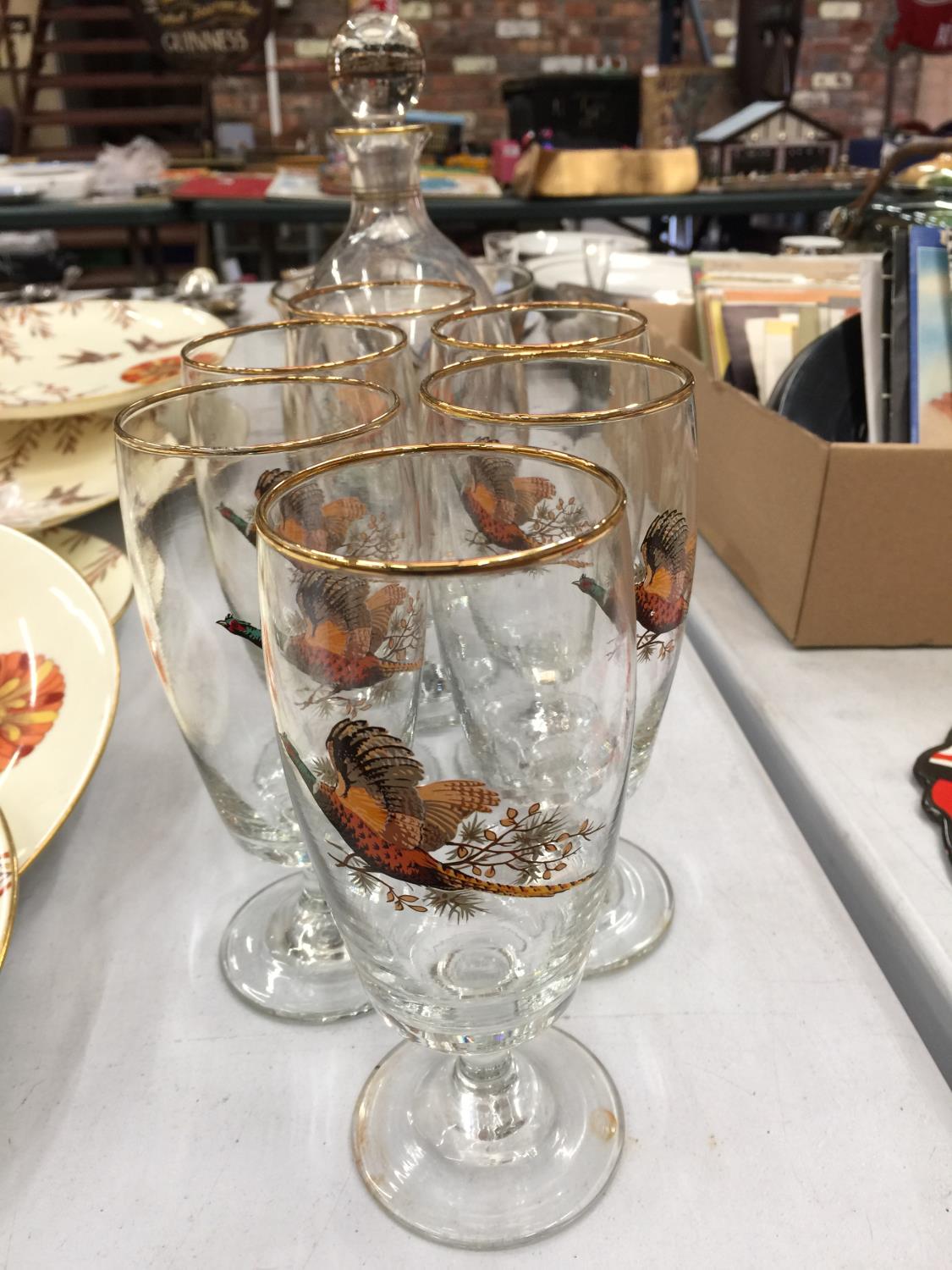 A SET COMPRISING A DECANTER, ICE BUCKET AND SIX GLASSES DEPICTING PHEASANTS