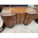 A MID 20TH CENTURY OAK BREAK POINT SIDEBOARD 54" WIDE BEARING LABEL R H TUCKER LTD 1141 NEWINGTON