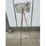 A DECORATIVE TRIPOD STANDARD LAMP