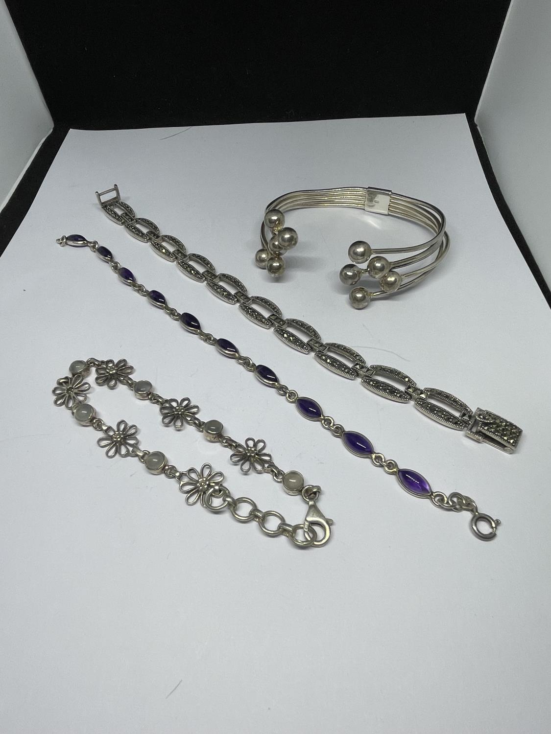 FOUR MARKED SILVER BRACELETS TO INCLUDE A BANGLE