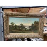 A GILT FRAMED OIL ON CANVAS OF A COUNTRY AND RIVER SCENE SIGNED J LEWIS
